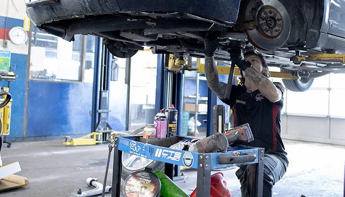 Mechanic At MacDonald's Auto a Local Automotive Repair Shop working on a car