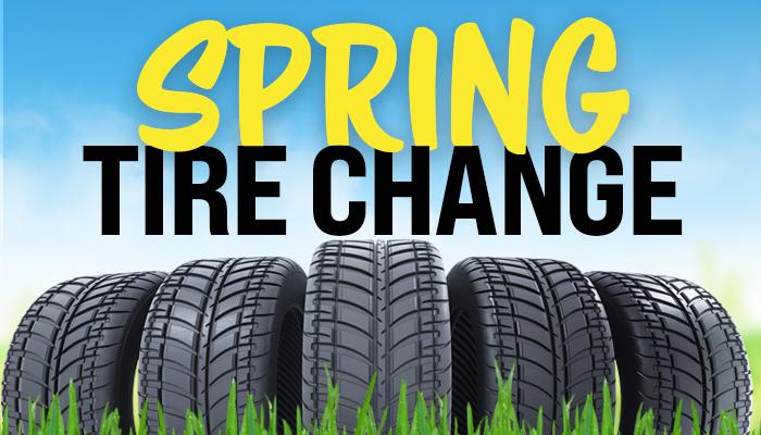 Image of tires in the grass with Spring Tire Change Title in the background
