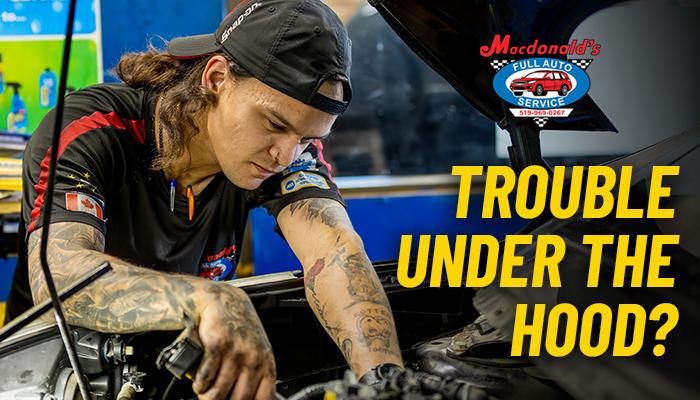 Technician working on engine